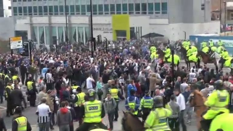 Violence: Scenes from outside St James' Park after the match