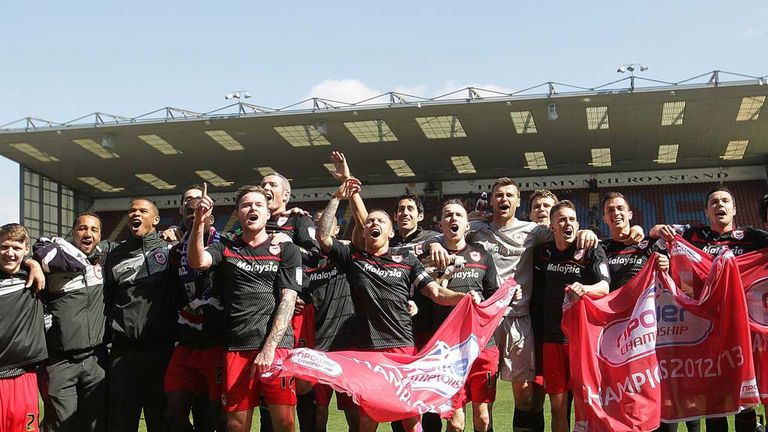 The Cardiff players celebrate clinching the Championship title at Burnley