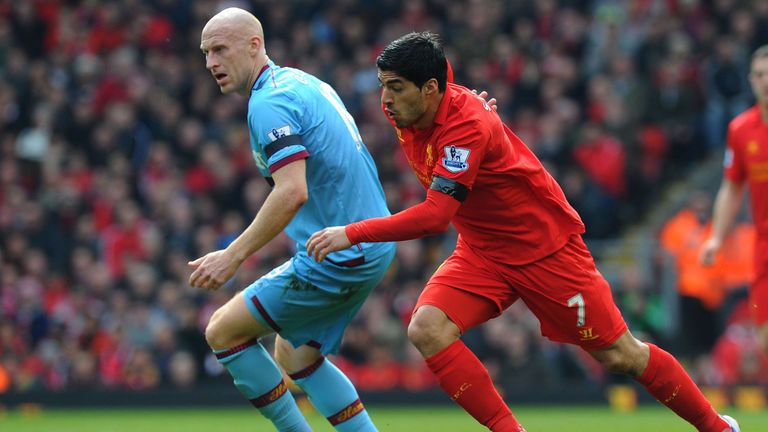 James Collins sticks close to Luis Suarez during Sunday's goalless draw