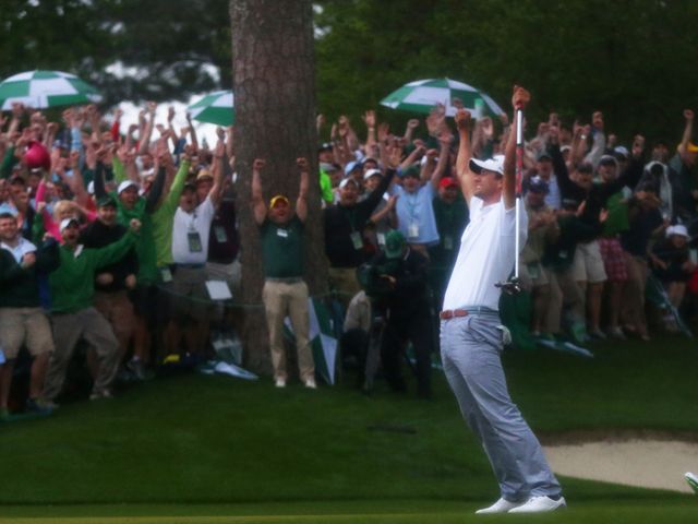 Adam Scott celebrates after sinking the winning putt