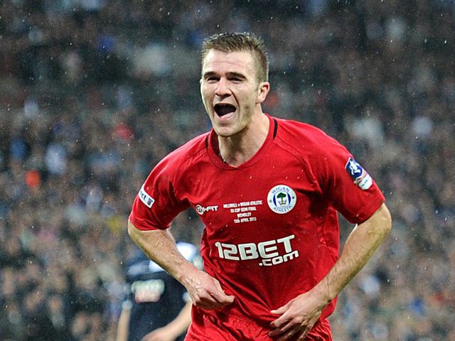 Callum McManaman celebrates his goal for Wigan