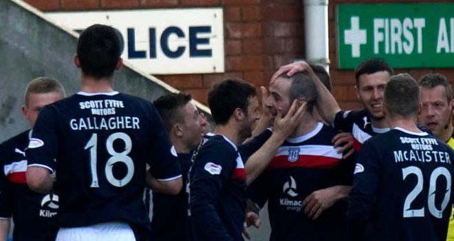 Gary Harkins: Congratulated by his Dundee team-mates