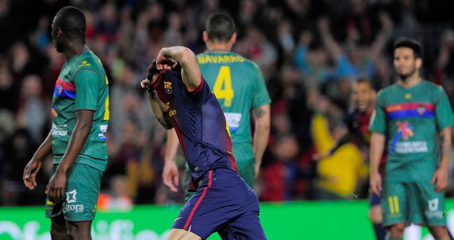 Cesc Fabregas celebrates his late goal at the Nou Camp