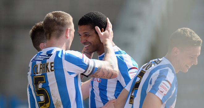 Jermaine Beckford: Celebrates his opener for Huddersfield with Peter Clarke