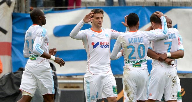 Benoit Cheyrou is congratulated on his winning goal