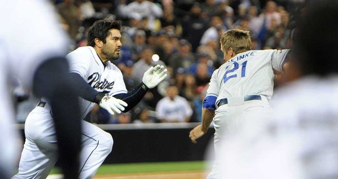 Collision course: Carlos Quentin charges at Zack Greinke
