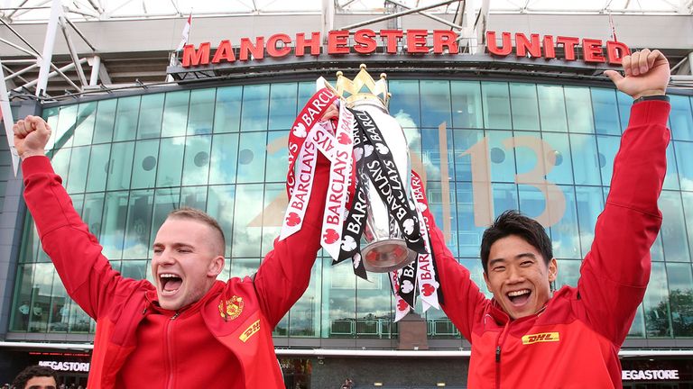Tom Cleverley (left) celebrates United's 20th Premier League title with Shinji Kagawa