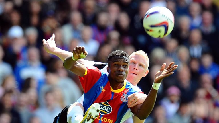 Wilfried Zaha: Holds off Peterborough's Craig Alcock