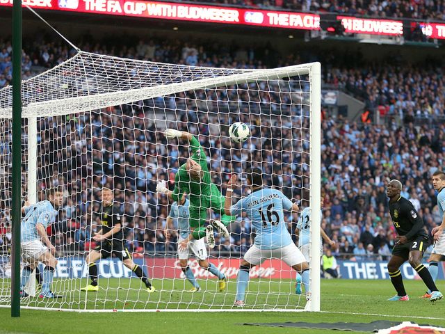 Ben Watson heads home Wigan's late winner at Wembley