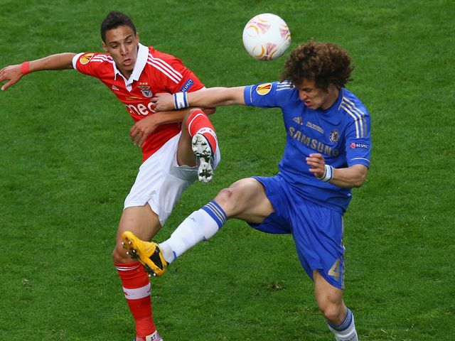 Lorenzo Melgarejo tangles with David Luiz as they battle for possession