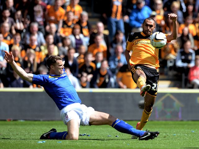 Ahmed Elmohamady clears the ball as Ben Turner closes in.
