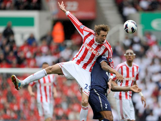 Peter Crouch feels he's fouled by Tom Huddlestone