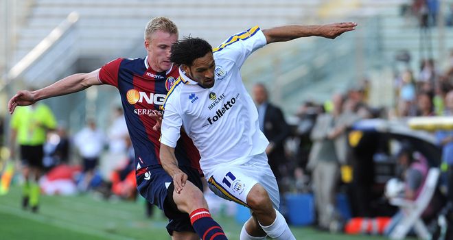 Carvalho de Oliveira Amauri is tackled by Frederik Sorensen