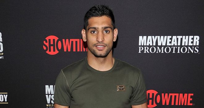 Amir Khan could be the next fighter who tries to take Floyd Mayweather's unbeaten record