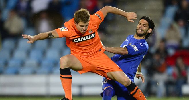 Angel Imanol Lafita vies with Inigo Martinez.