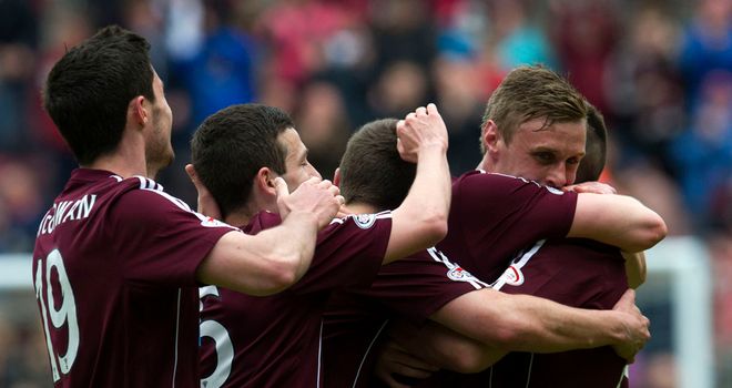Kevin McHattie is mobbed by team-mates after doubling Hearts' lead against St Mirren