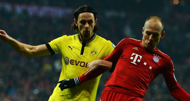 Neven Subotic locks horns with Arjen Robben earlier in the season