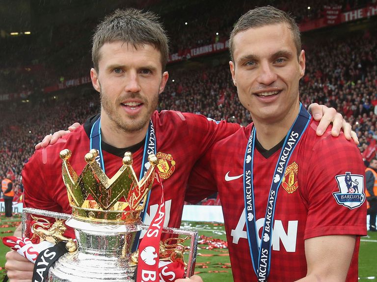 Michael Carrick and Nemanja Vidic after winning the title last season