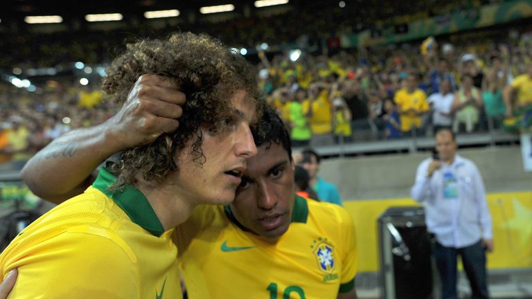 David Luiz and Paulinho: Chelsea defender has backed Brazil midfielder to shine in the Premier League