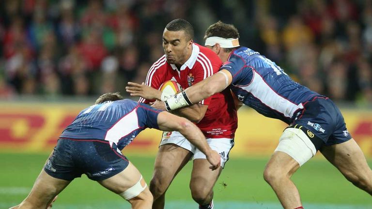 Simon Zebo is tackled by Mitch Inman and Lachlan Mitchell