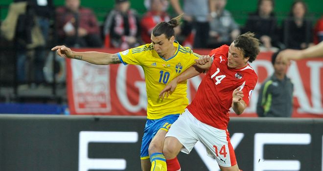 Austria's Julian Baumgartlinger vies with Zlatan Ibrahimovic