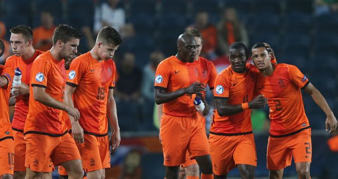 Holland celebrate after Ola John makes it 3-1 against 10-men Russia