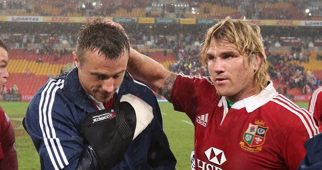 Tommy Bowe (left) nurses his suspected broken hand
