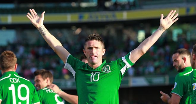 Robbie Keane celebrates a hat trick as he becomes Republic's most capped player