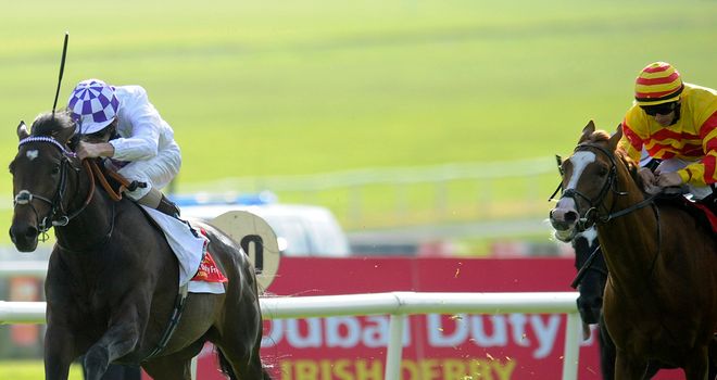 Galileo Rock chases home Trading Leather in the Irish Derby