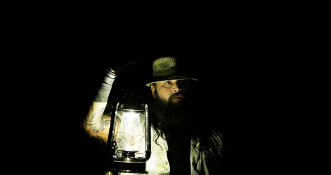 Shadow person: Bray Wyatt emerges from the darkness with his lantern in tow