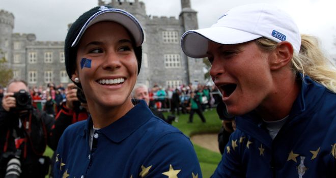 Azahara Munoz and Suzann Pettersen celebrate their team's dramatic 15-13 victory