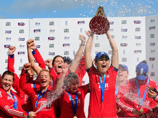 England captain Charlotte Edwards lifts the Ashes trophy