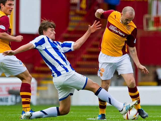 Jackson Irvine closes down James McFadden.