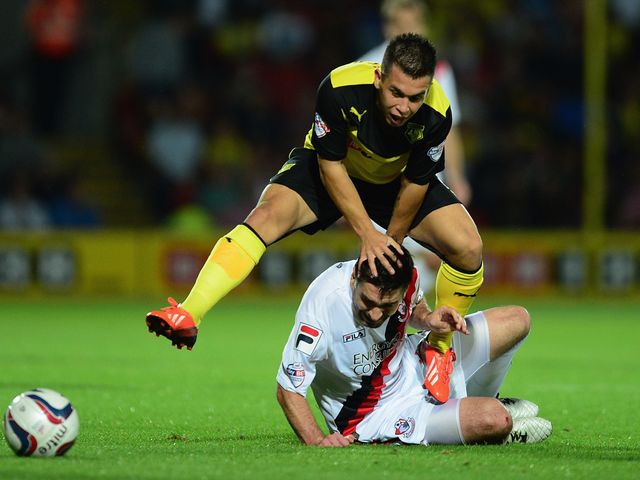 Cristian Battocchio hurdles Andrew Surman