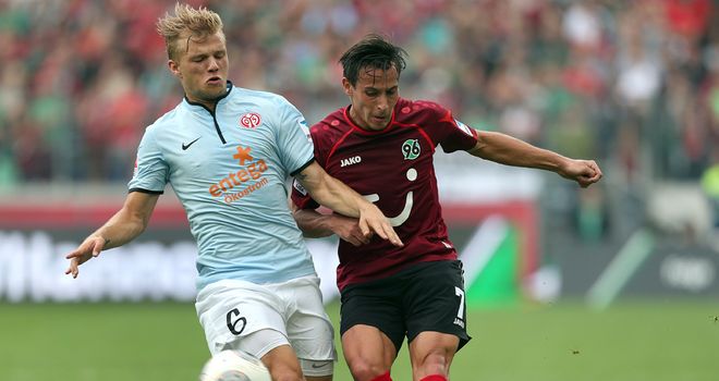 Johannes Geis and Edgar Prib battle for the ball