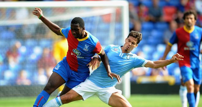 Yannick Bolasie of Palace competes for the ball with Hernanes of Lazio