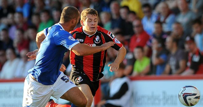 Ryan Fraser and Joe Devera battle for the ball during the tie