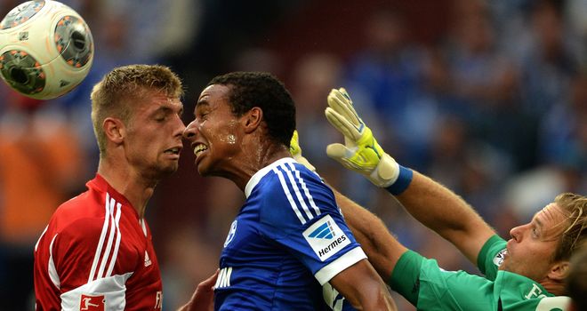 Timo Hildebrand tries to punch the ball clear.