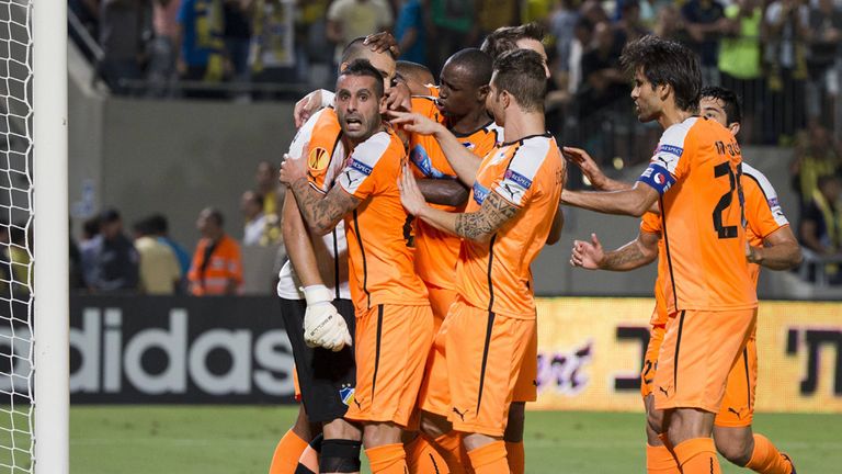 APOEL Nicosia celebrate Urko's penalty save