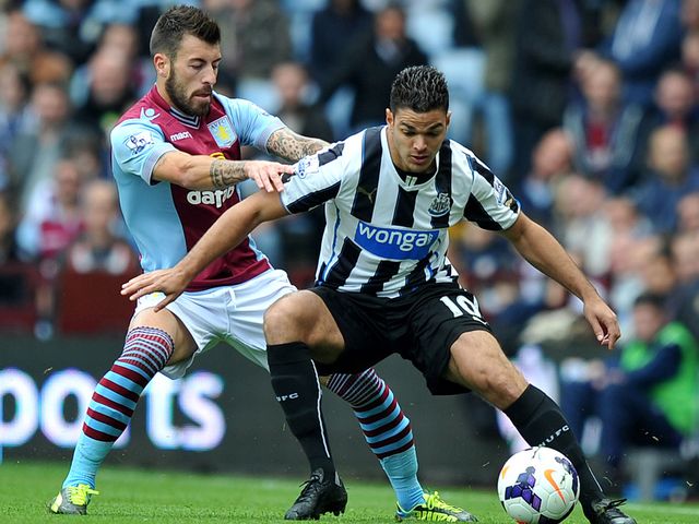 Hatem Ben Arfa holds off Antonio Luna