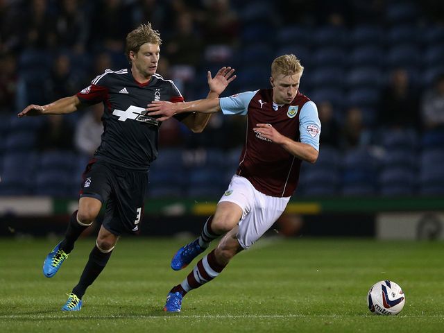 Ben Mee keeps track of Dan Harding