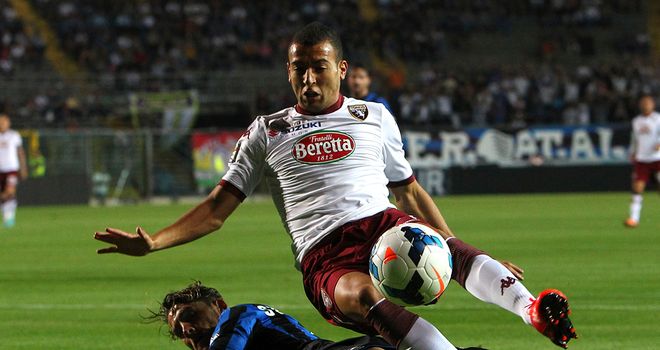 Omar El Kaddouri tries to jump over a challenge.