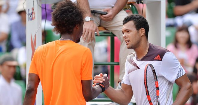 Jo-Wilfried Tsonga (r) shakes hands with Gael Monfils