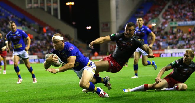 Carl Ablett crashes over for Leeds against Wigan at the DW Stadium