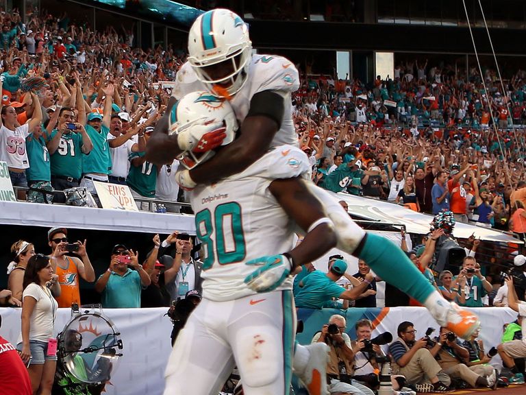 Dion Sims celebrates his winning touchdown