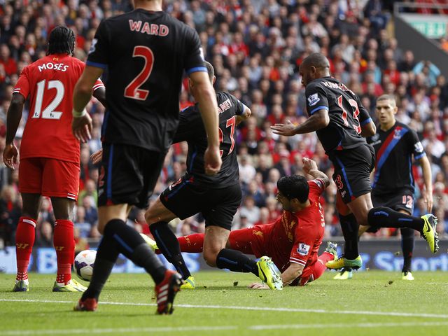 Luis Suarez sweeps home Liverpool's opening goal