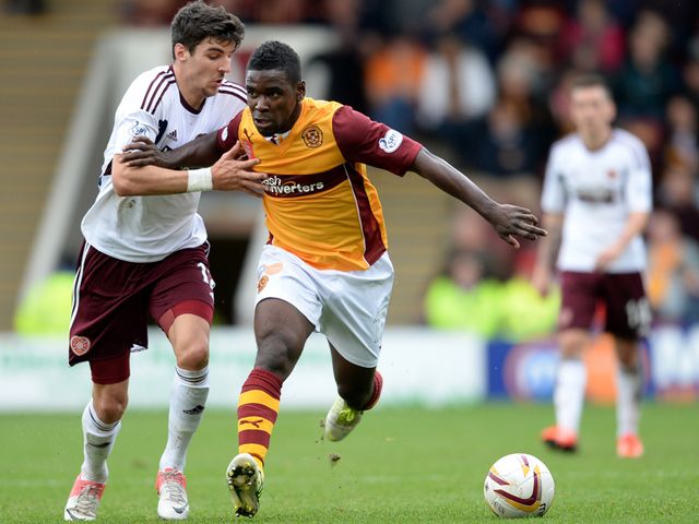 Callum Paterson competes for the ball with Zaine Francis Angol