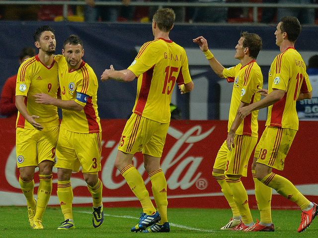 Romania celebrate Ciprian Marica's opening goal