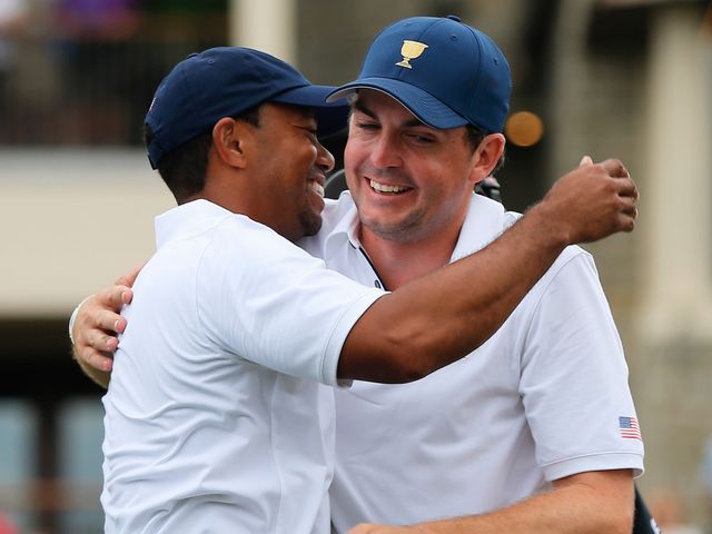 Tiger Woods celebrates wtih Keegan Bradley