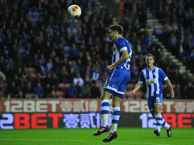 Nick Powell scores Wigan's opening goal